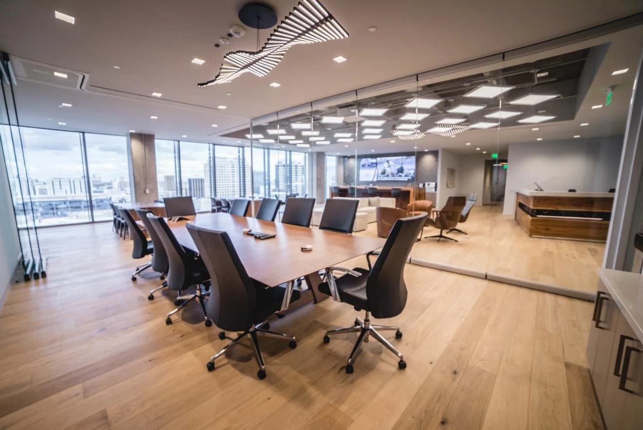 Glass-walled conference room on the 19th floor with downtown Austin skyline views
